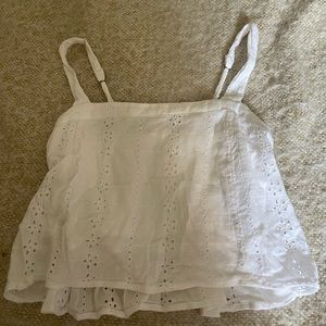 Cute white top. Extra Small. Adjustable straps with a built in bra. Cropped.